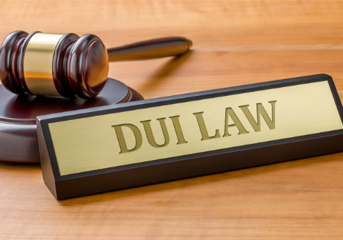 A name tag with DUI Law written on it, in front of a gavel