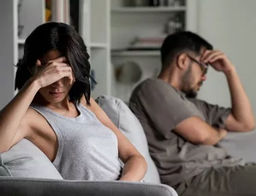 A young couple ignore each other after visiting Essig Law Office, which practices family law in the Peoria IL area, including divorce