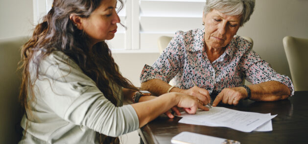 An elderly woman meets with her power of attorney