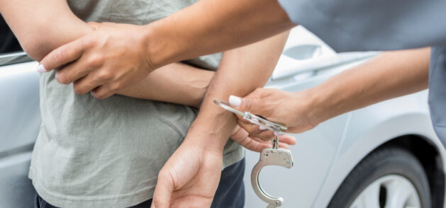 A person gets handcuffed. Essig Law Office offers legal defense for Felonies & Misdemeanors in IL